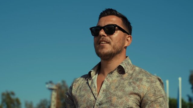 Handsome man in glasses walks by smiling. business man. 4k