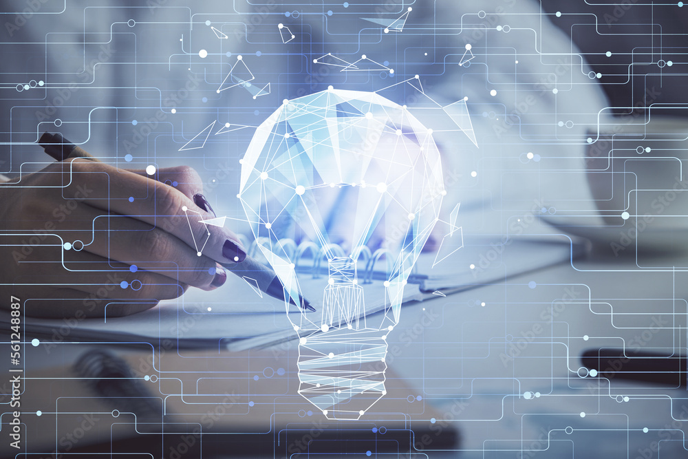 Poster bulb hologram over hands taking notes background. concept of idea. double exposure