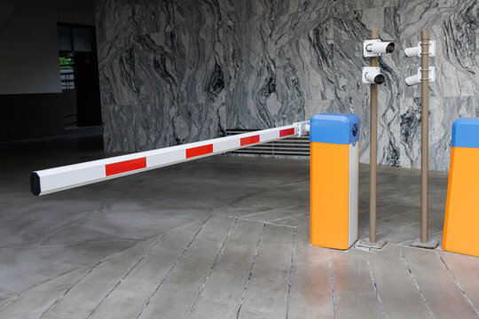car park barrier with recoding CCTV camera, automatic entry system.