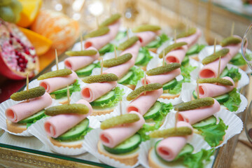 Meat delicatessen plate on banquet table