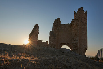 Caudilla Castle with sun rays at sunset. Toledo, Spain