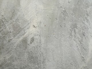 grey cement wall background with dark pattern.
