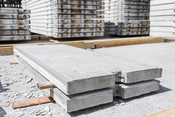 Reinforced concrete slab for railway crossings with metal corners at the edges in the warehouse of...