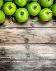 Green fresh apples with leaves.
