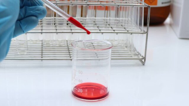 Red chemical in glass , chemical in the laboratory and industry, Chemical used in the analysis