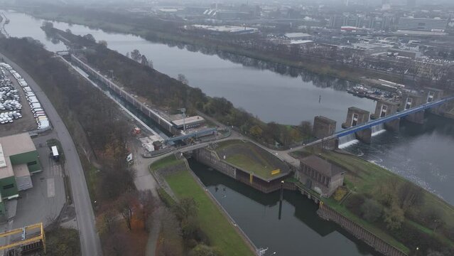 The Ruhrwehr Duisburg is a weir on the Ruhr in Duisburg. It is located on the Ruhr 2.626 km before it flows into the Rhine. Aerial drone view.