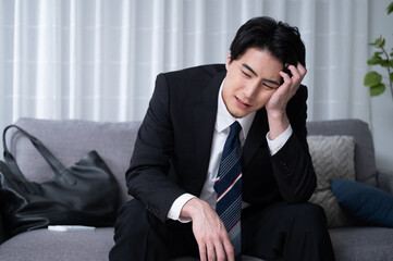 Japanese businessman exhausted from work