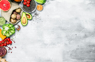 Healthy food. Assortment of organic vegetables and fruits with legumes.