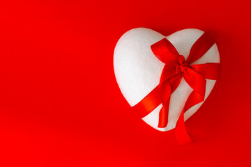 Valentine's Day. A heart on a red background. A greeting card. A symbol of love