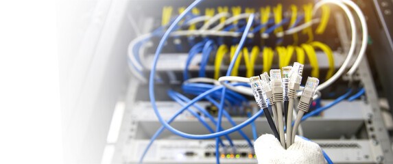 Hand choose RJ45 UTP Cat6 LAN internet network cable fiber optic and Lots of Ethernet cables for connect computer and networking devices system to switch or hub modem router in rack cabinet.