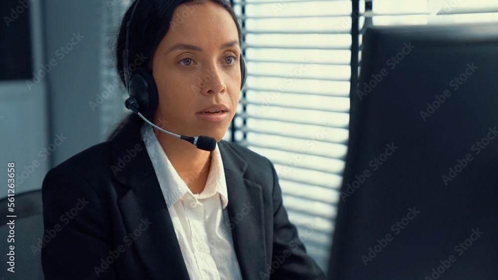 Poster competent female operator working on computer and talking with clients. concept relevant to both cal
