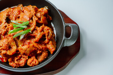 jeyukbokkeum, Korean style stir-fried pork : Thinly sliced pork marinated in spicy ginger-gochujang and stir-fried with onion, carrots, perilla leaves, or abbage. Ingredients vary according to taste.