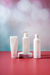 set of bottles for cosmetics on a purple-blue background