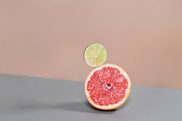 Immune boosting citrus fruits for supply of organism with vitamin. healthy eating, fresh food, Balancing grapefruit, lime, sliced. Trendy, modern, pastel