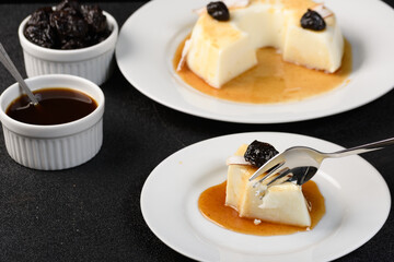 fork cutting coconut blancmange slice