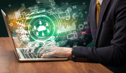 Business hand typing on a modern laptop