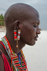 Maasai warrior on the beach Diani Beach, Kenya Mombasa January 26 2012