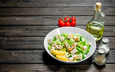 Healthy salad. Salad with cucumbers, chicken and Chinese cabbage poured lemon juice .