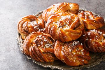 Kanelbullar or Kanelbulle is a traditional Swedish cinnamon buns flavored with cinnamon and...