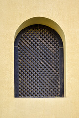 Egyptian house exterior. Arched window in wall of arabic building. Copy space. Selective focus.
