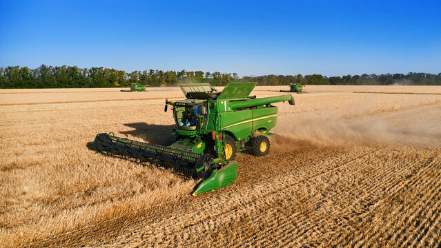 John Deere harvester works in the field. Combine Harvesting Wheat. Field field of cereals during harvesting. Modern equipment works. 07.07.22, Rostov region, Russia