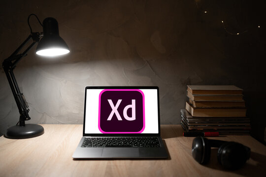 Ukraine, Odessa January 9, 2023: Desk with laptop and Adobe XD logo, interface design software from Adobe Systems