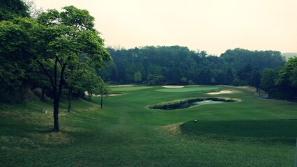 a golf course with beautiful green grass
