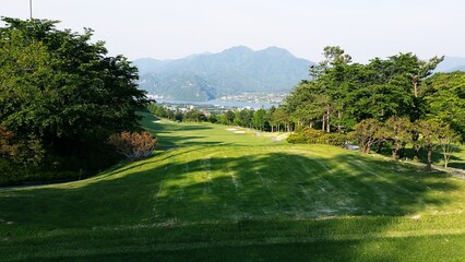 Fototapeta na wymiar a golf course with beautiful green grass