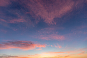 Colorful sunrise sky with pink, orange and yellow clouds