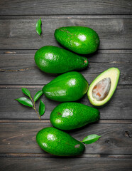 Ripe avocado and one half avocado.