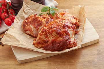 Marinated chicken leg in tomato sauce