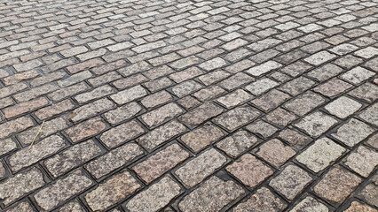 Fototapeta premium paving stone of parallelepipeds, old pavement street
