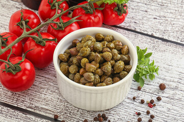 Marinated green capers in the bowl