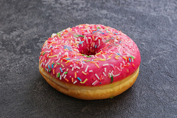 Sweet glazed struwberry donut with icing