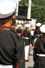 Younger group of a military school in formation to patriot parade of Honduras wearing military clothing and hats.