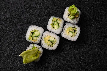 Vegetarian sushi roll on black