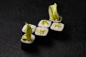 Vegetarian sushi roll on black