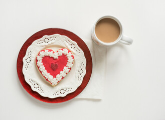 Valentine Cookie on White and Red Plates with Cup of Coffee