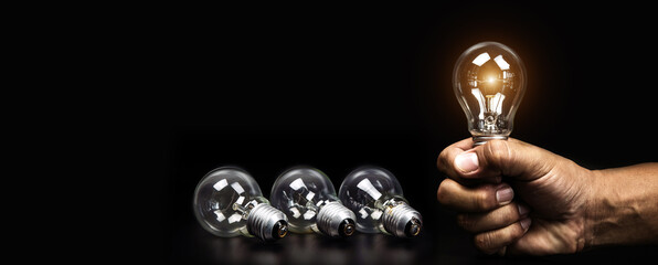 Close up hand choose light bulb or lamp with bright light for human resources or leadership and...