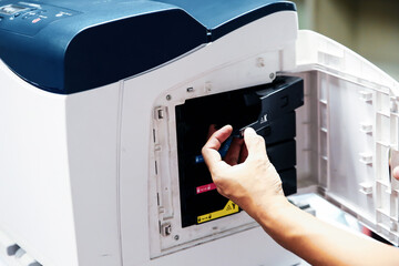 Technician hand open cover printer photocopier or photocopy to replace ink cartridges or fix paper...