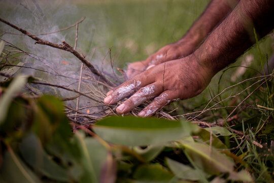 Aboriginal man starting a fire