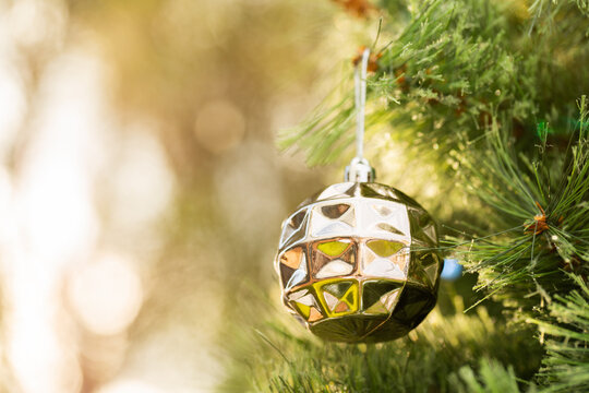 Golden Christmas bauble with bokeh copy space