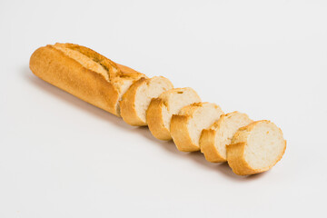 Sliced french baguette on a white background with space for text