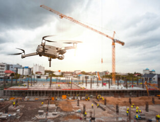 Fototapeta na wymiar Drone over construction site. video surveillance or industrial inspection.