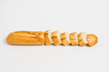 Sliced french baguette on a white background with space for text