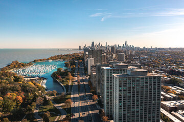 Beautiful aerial cityscape view of downtown Chicago above Lake Shore Drive with Belmont Harbor and...