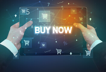 Close-up of a hand holding tablet with shopping inscription