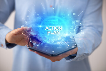 Businessman holding a foldable smartphone, new business concept