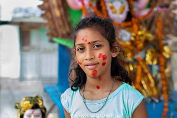 Girl standing in front of statues of the goddess