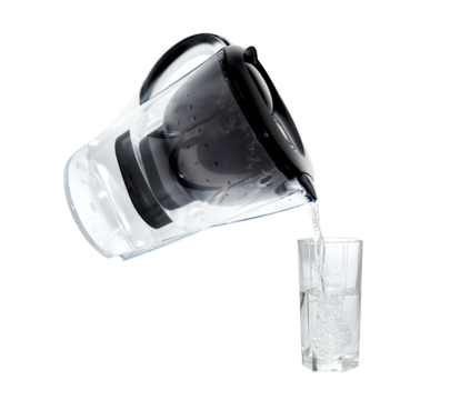 Water filter pours water into a glass beaker on a white background